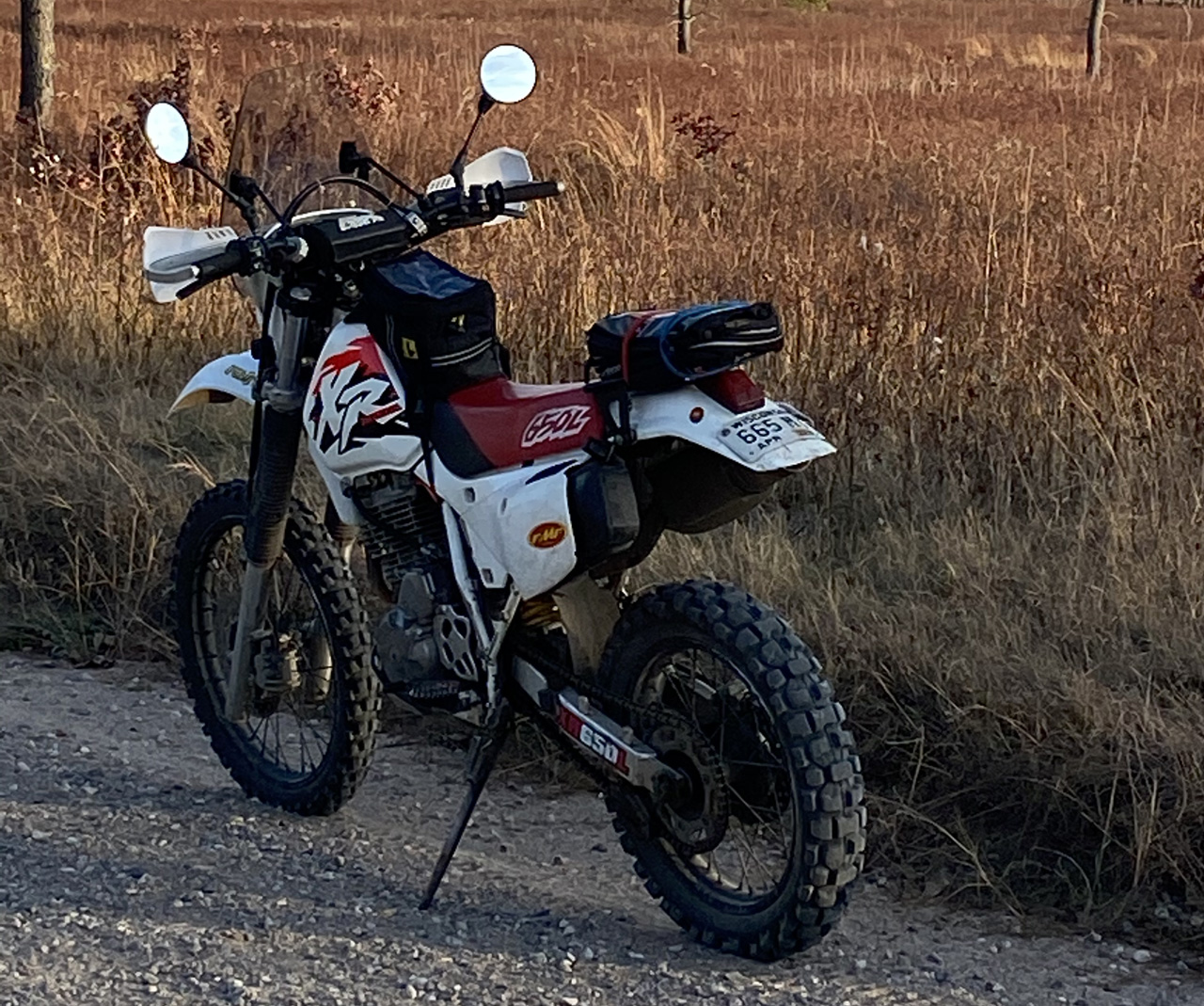 Honda XR650L gravel road through wheat fields